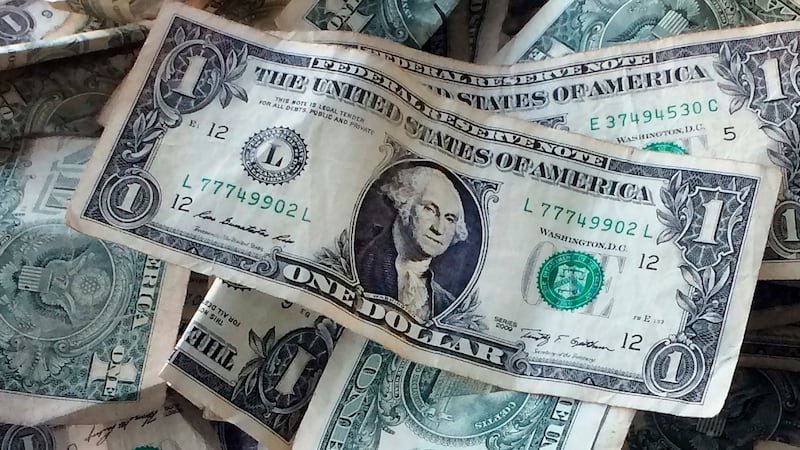 A pile of dollar bills.