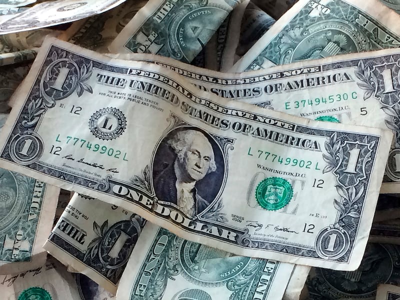 A pile of dollar bills.